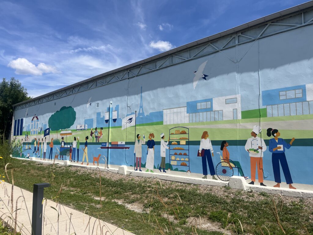 A contemporary mural facing a place steeped in history